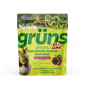 Yellow-green Shrek Kids Grüns Superfoods Greens Gummies package featuring Shrek and Donkey, labeled 'Berry Far Far Away' flavor, listing Daily Essentials, Supports Developmental Growth, Yummy Taste, Dietary Supplement, 28 Daily Packs, for ages 2 to 13, transparent background.