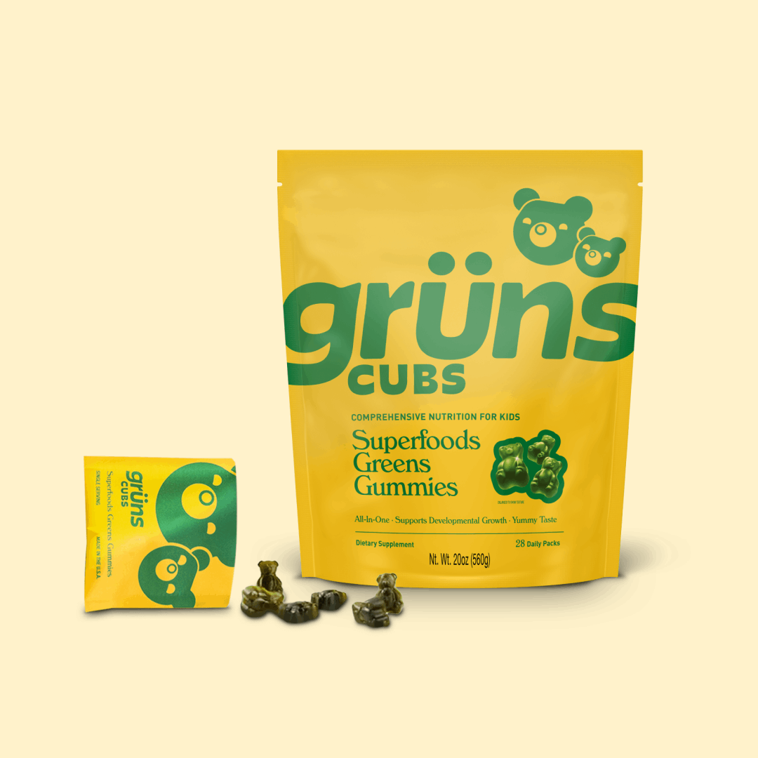 Yellow packaging of Grüns Cubs Superfoods Greens Gummies for kids.
