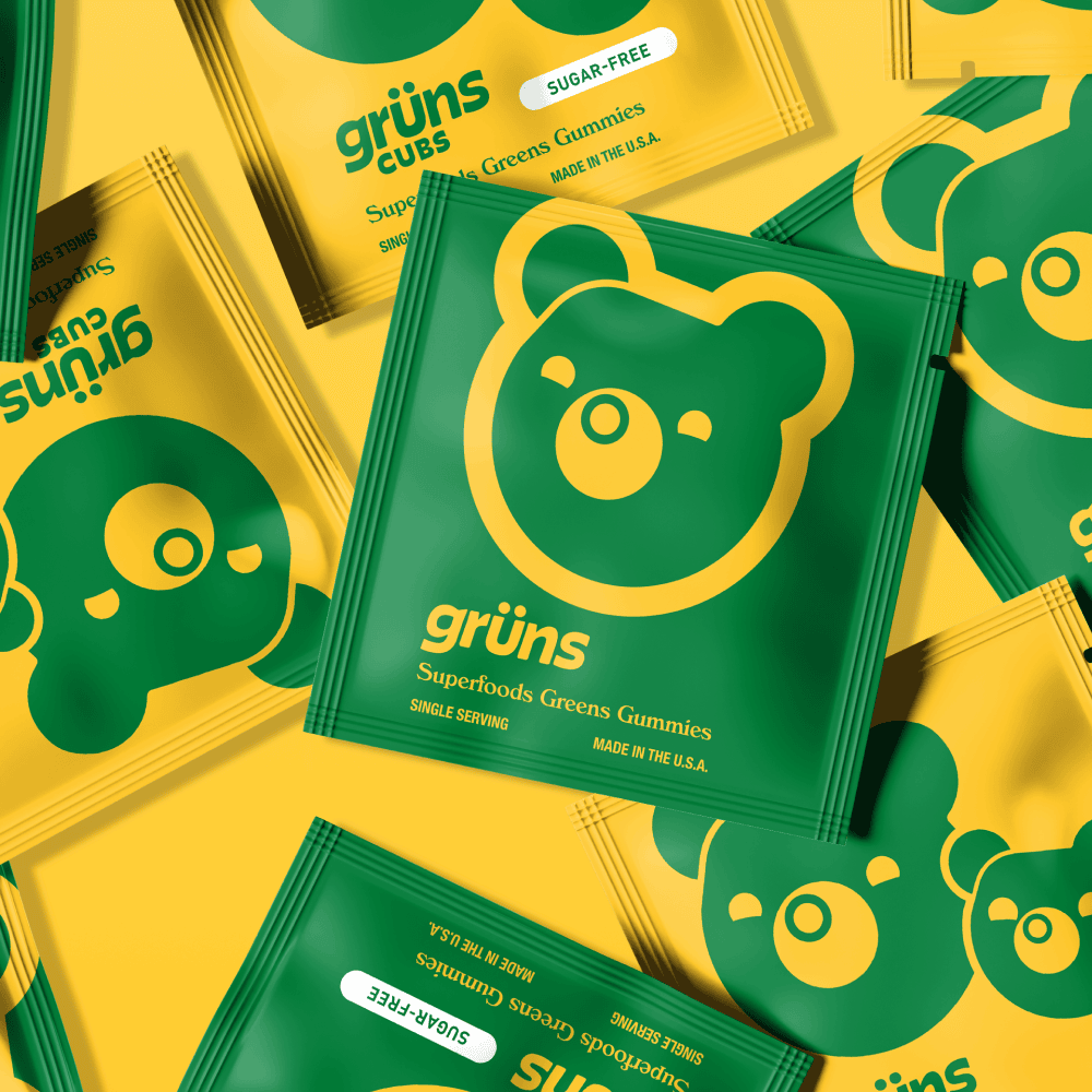 Colorful packaging of Grün's Superfoods Green Gummies with bear design.
